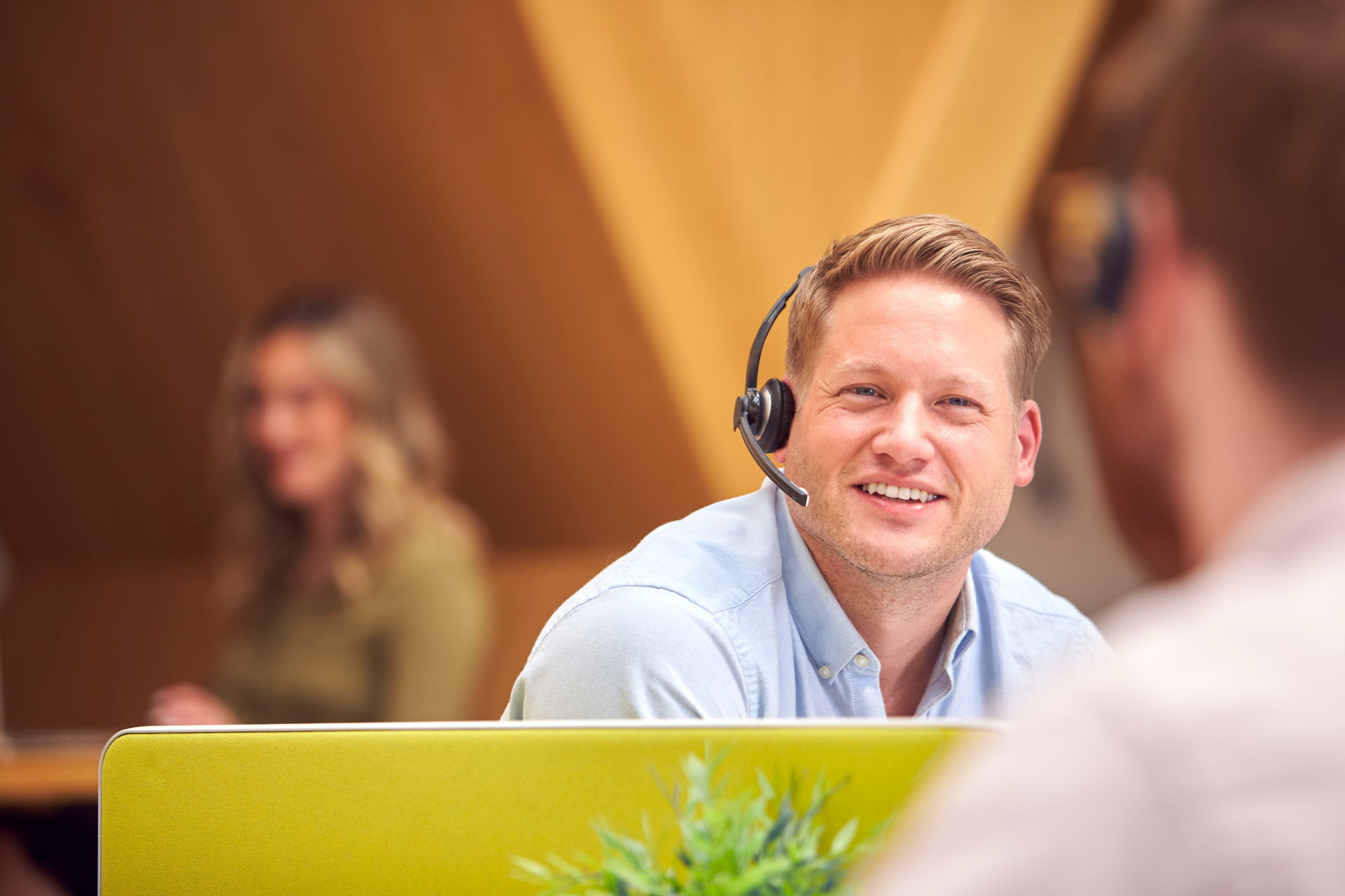 Businessman In Cubicle Wearing Headset Talking To 2021 12 09 06 51 08 Utc